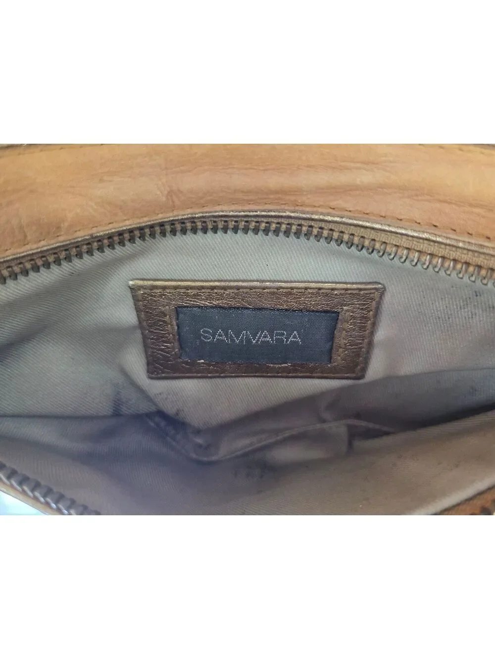 Samvara Leather Wristlet Clutch with Gold Embroidered Detail
